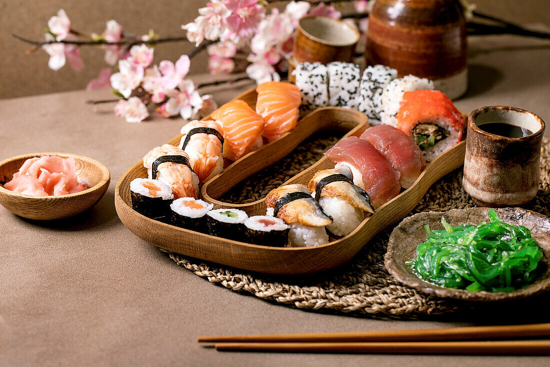 Sushi rolls set, traditional japanese dish sushi rolls with fresh salmon, tuna, eel, prawns on rice