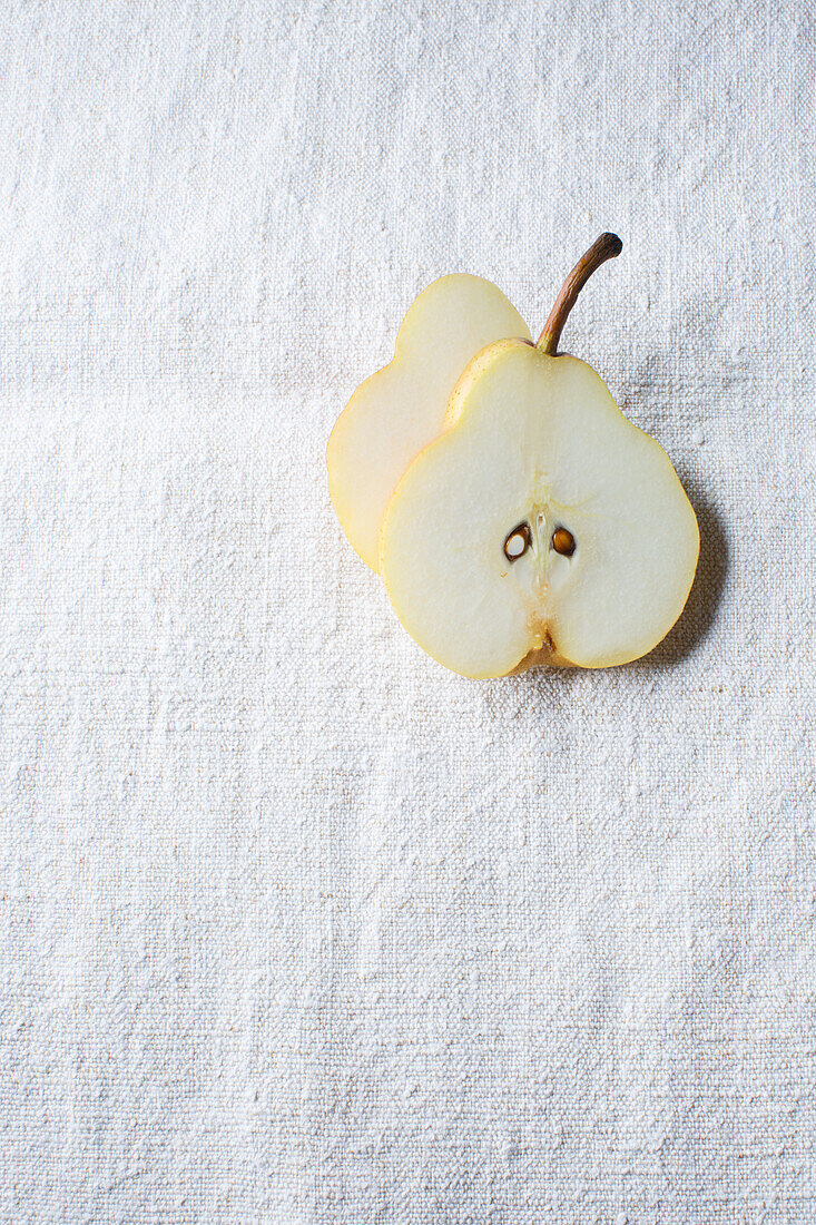 Pear slices on a white linen cloth