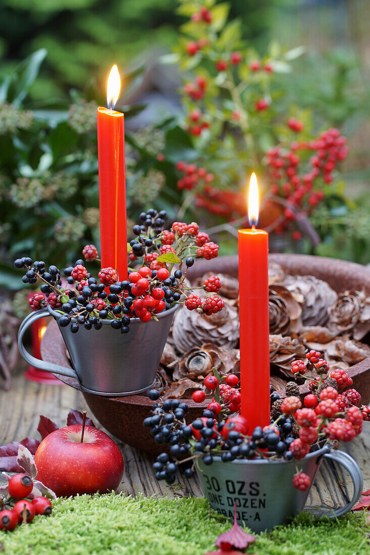 Berries and candles as table decoration in autumn