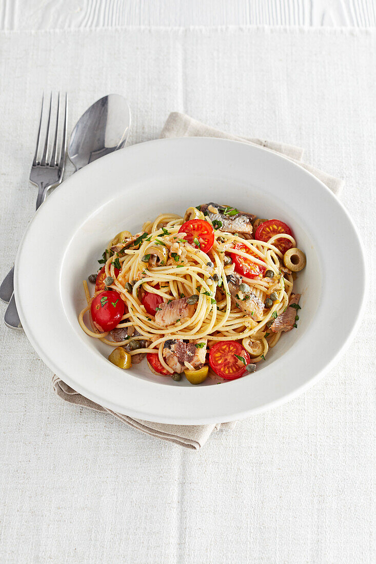 Spaghetti with sardines, tomatoes, and olives