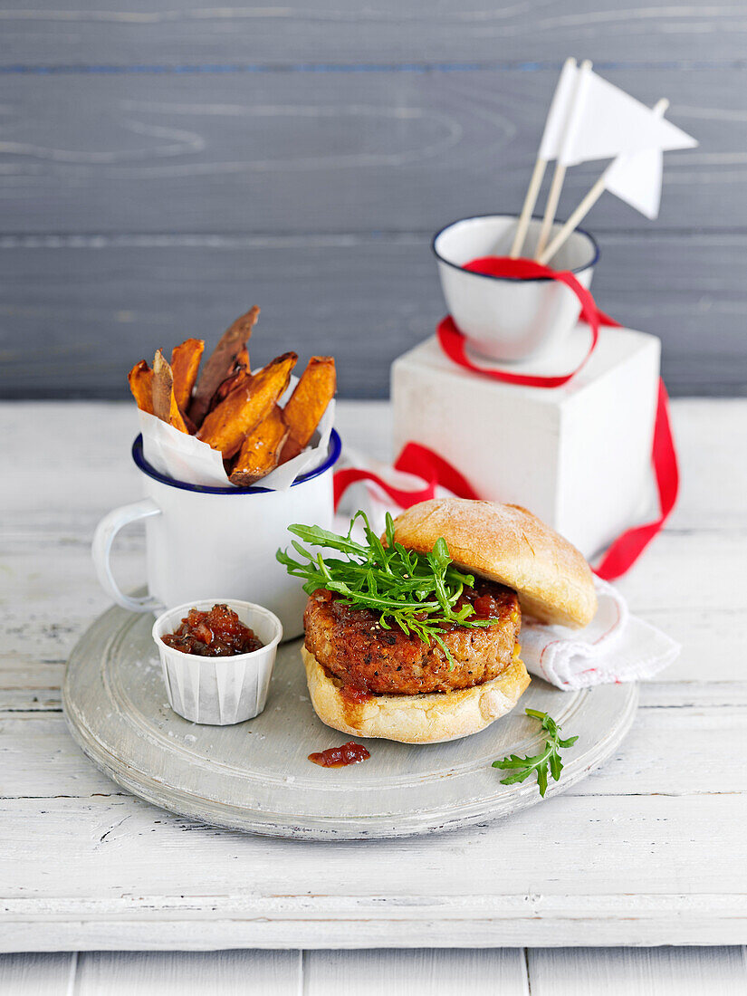Homemade burgers served with sweet potato fries