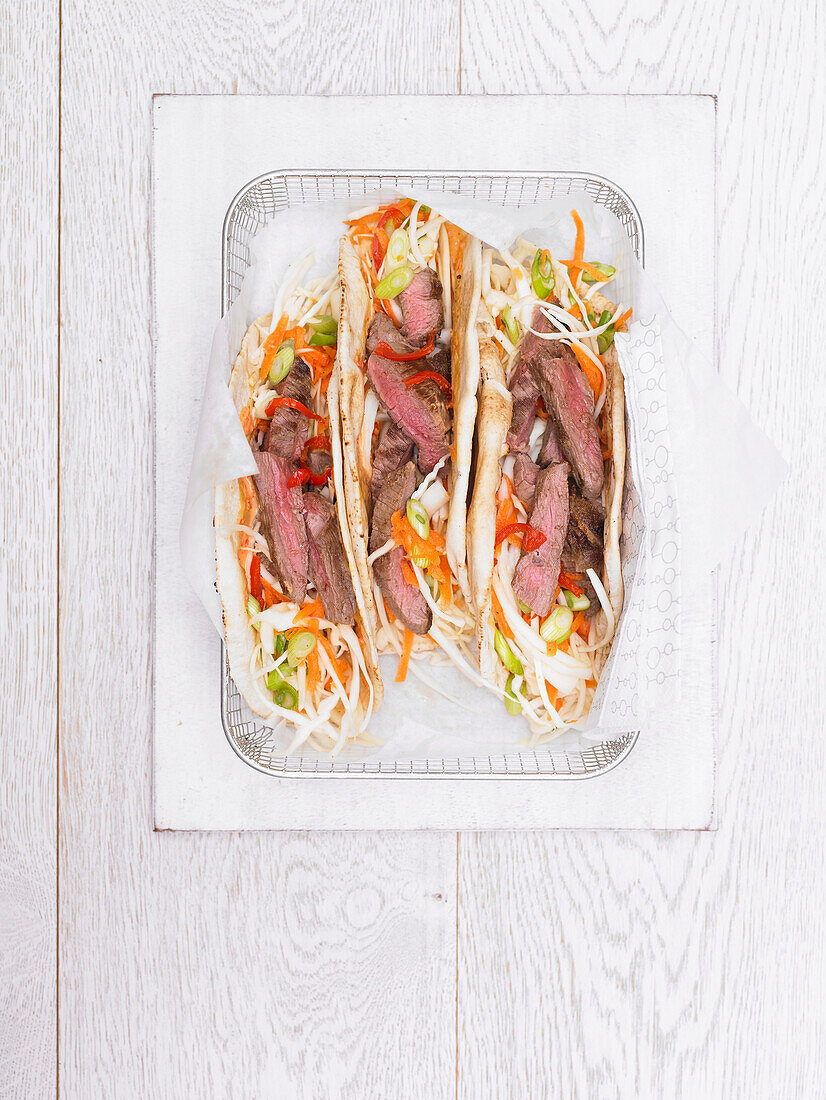Spicy cumin lamb wrap with crunchy coleslaw and spicy mayo