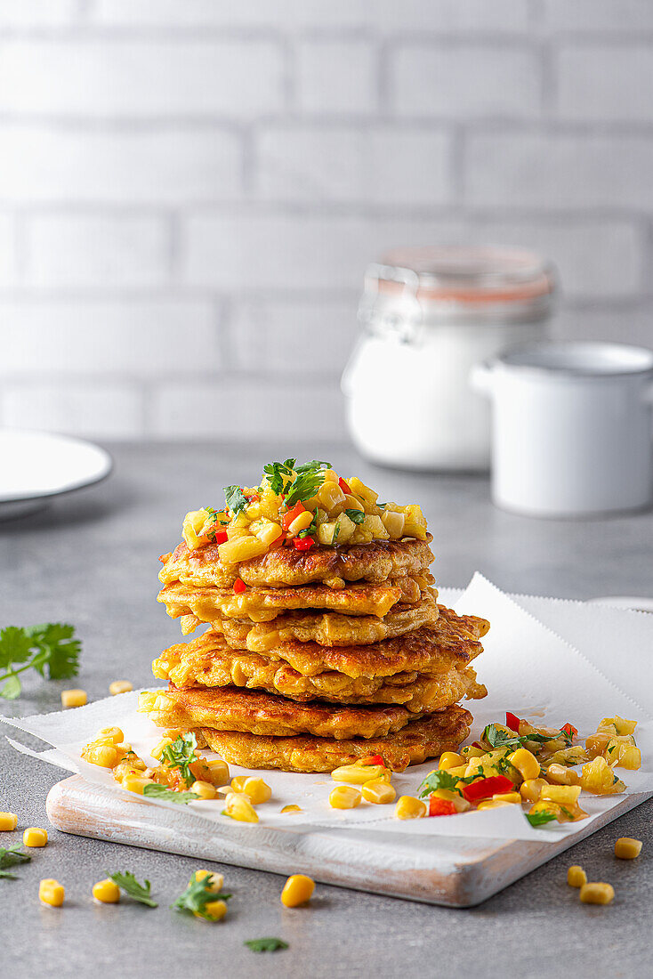 Vegeterian pancakes made with sweetcorn with pinapple, chili and coriander salsa