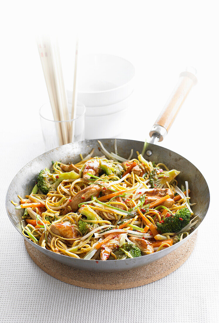 Chow Mein with chicken in a wok (China)