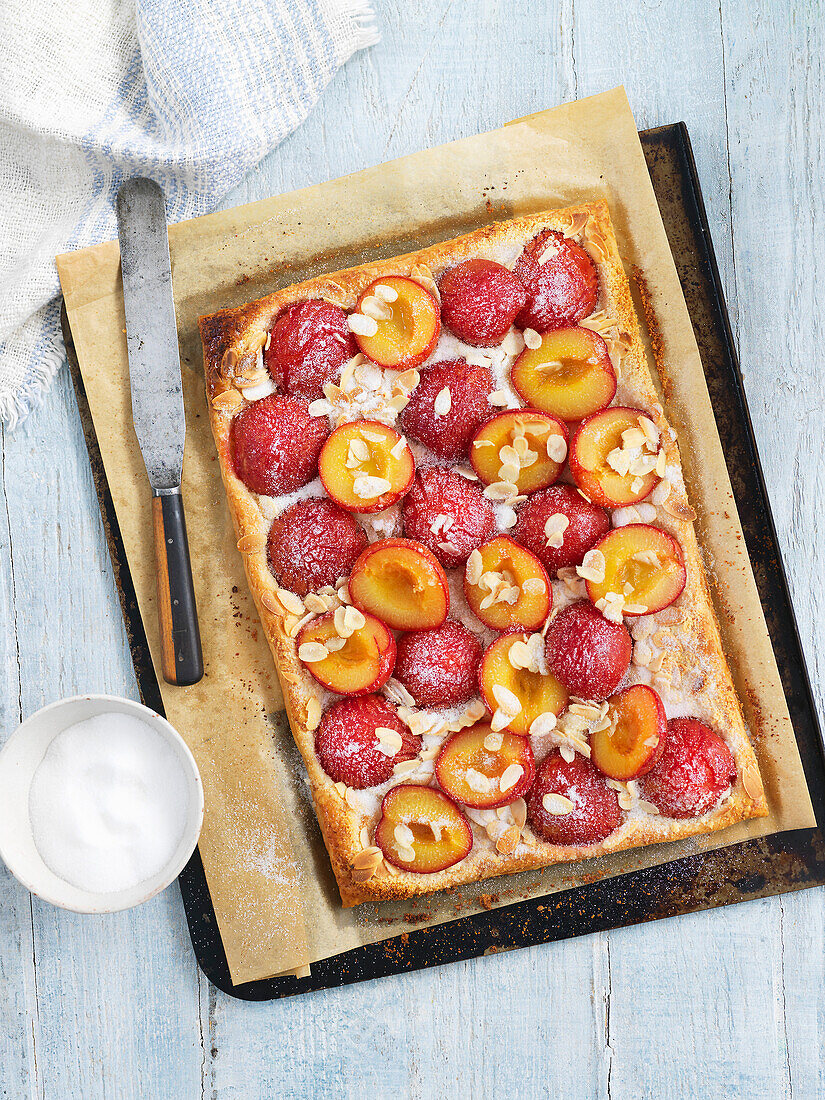 Plum and almond cake on a tray