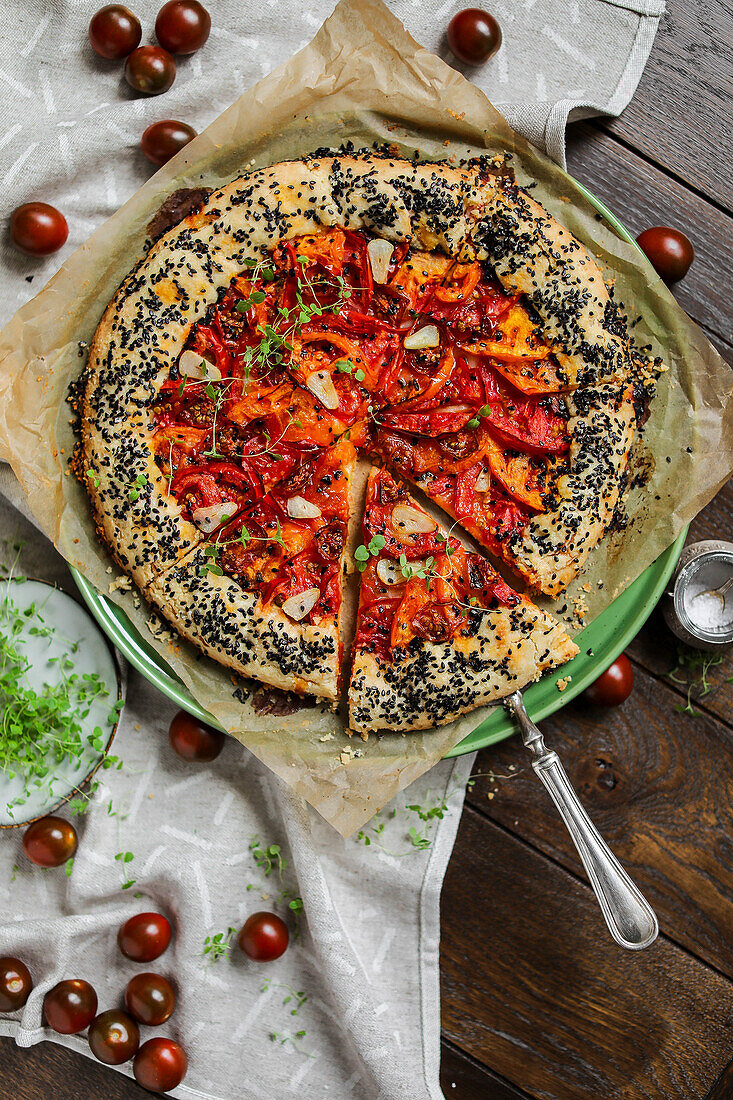 A savoury galette with tomatoes and black sesame seeds