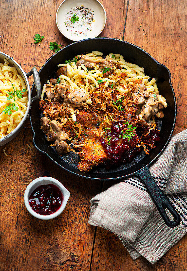 Classic hunter's schnitzel with spaetzle and cranberries