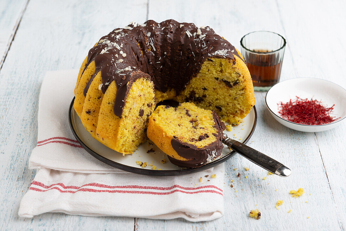 Vegan Bundt cake with saffron, dark and white rice-milk chocolate