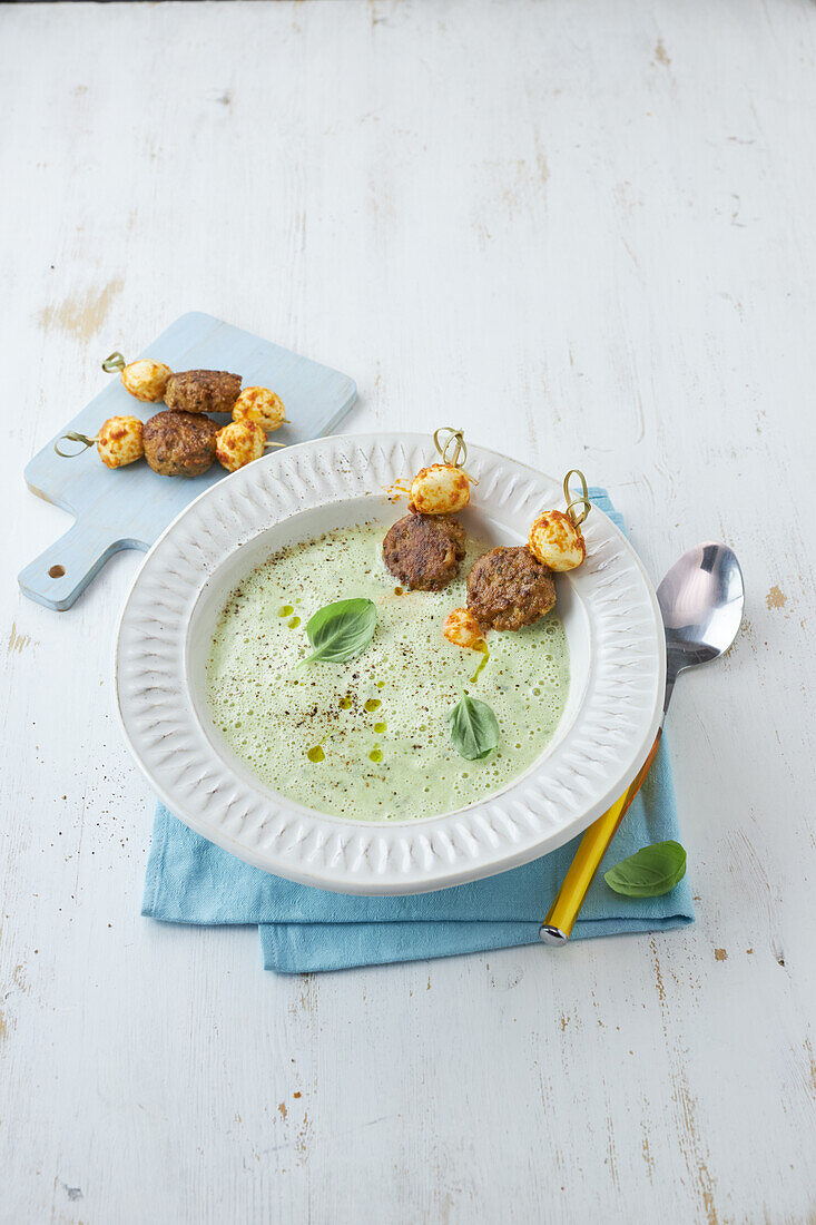 Zucchini herb soup with veggie meatballs