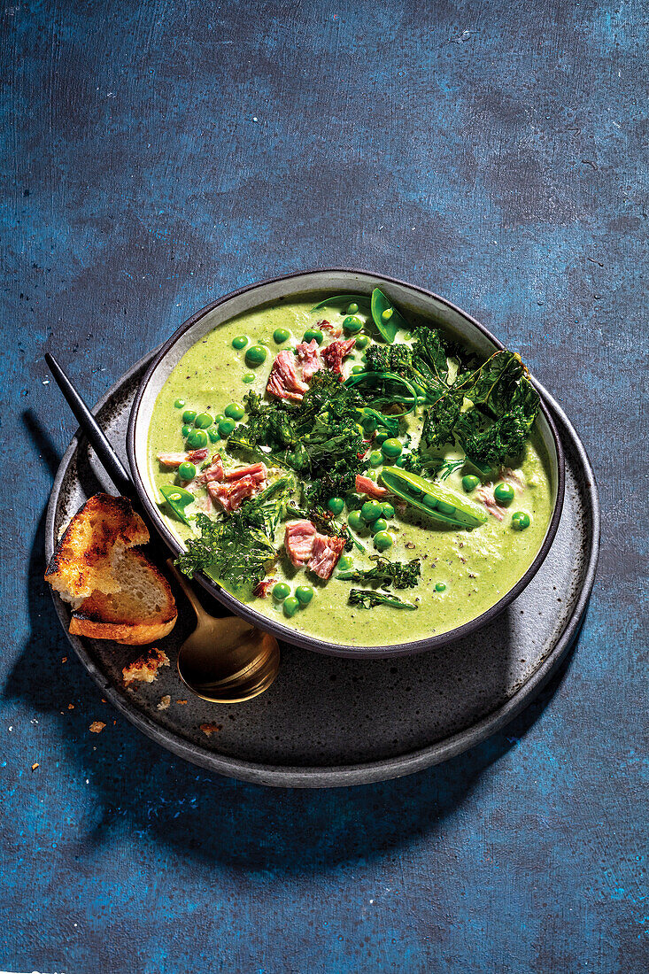 Creamy soup with broccoli, peas, and ham