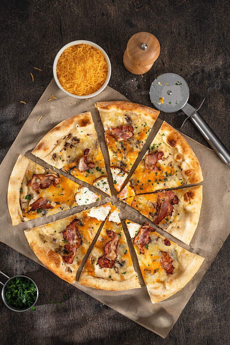 Pizza carbonara with egg and cheddar cheese