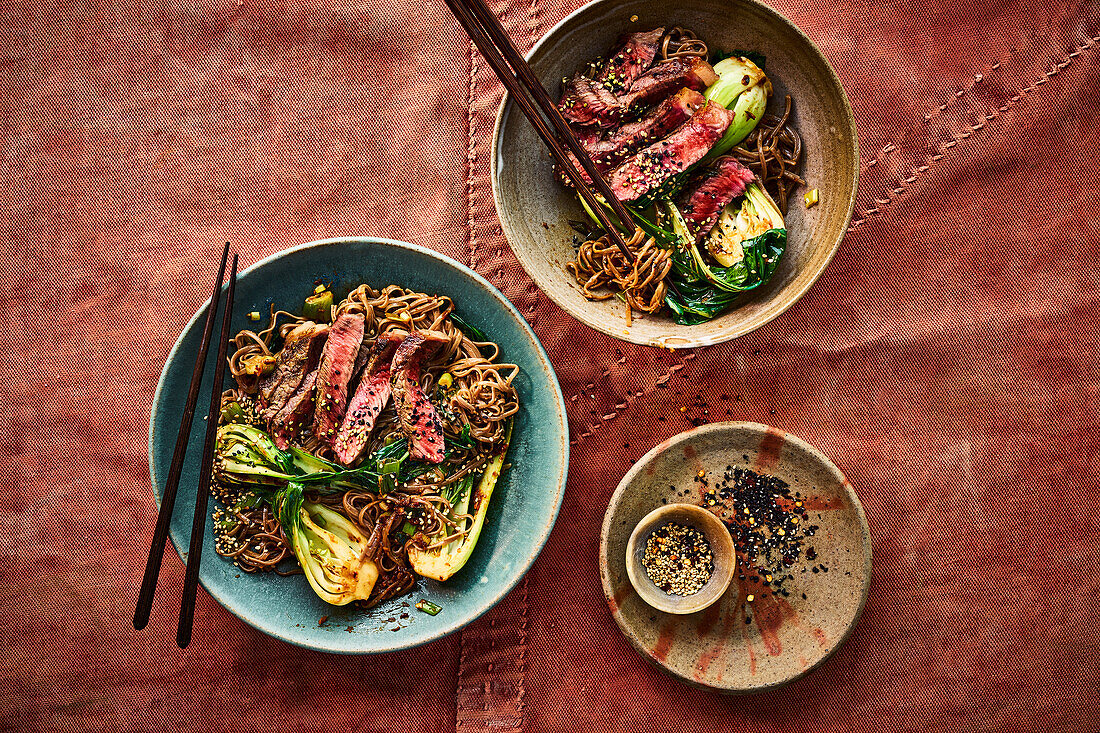 Bowl with buckwheat noodles, sesame steak, and bok choy (Asian)
