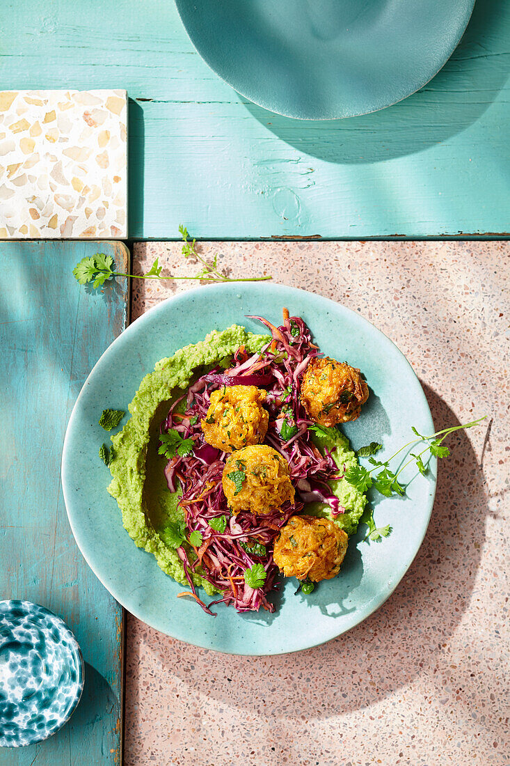 California coleslaw on pea-mint hummus with sweet potato balls