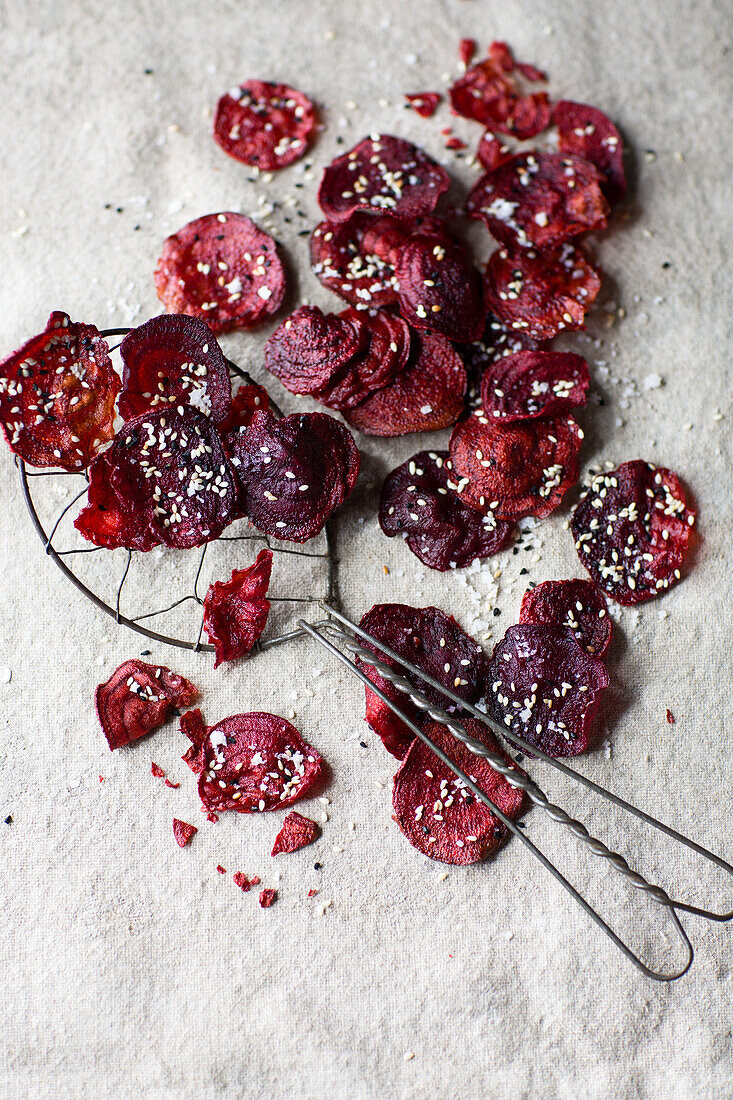 Fried beetroot slices with white sesame seeds