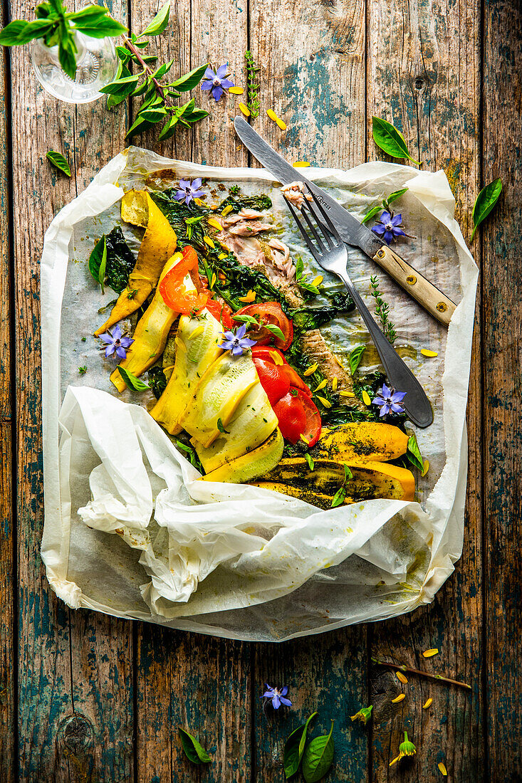 Fillet of carp wrapped in a parchment parcel with vegetables