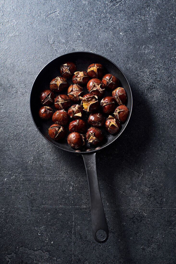 Roasted chestnuts in a pan