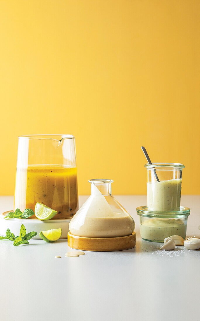 Passion fruit and pineapple vinaigrette, honey and garlic dressing, and garlic aioli