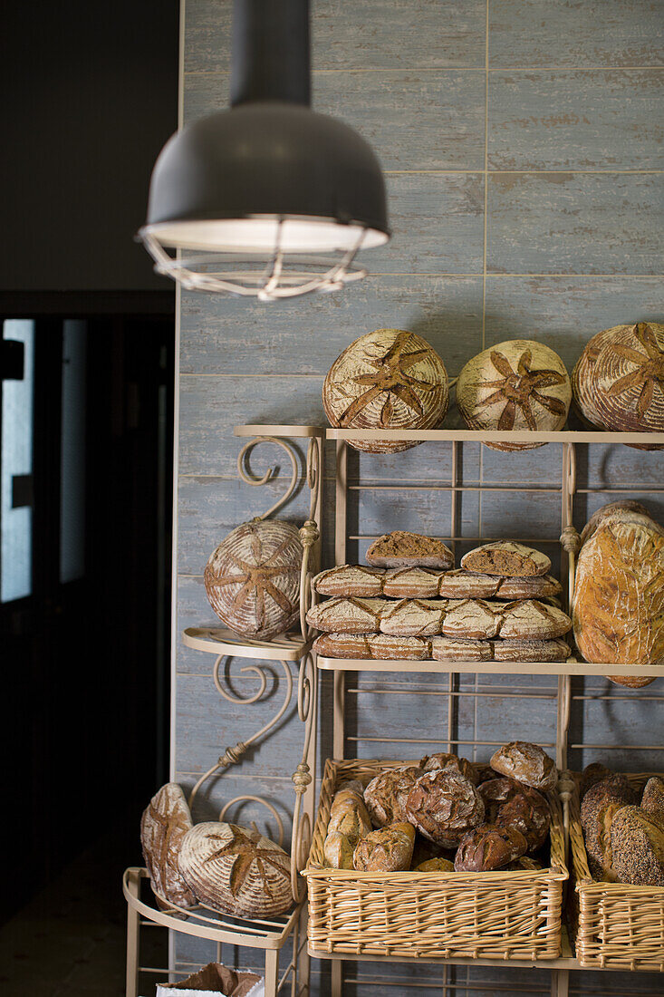 Shelf with different kinds of bread in a French bakery