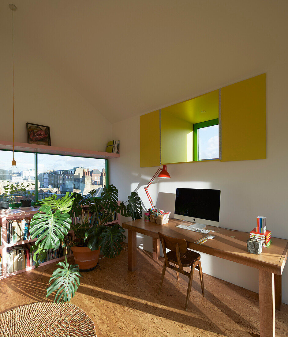 Study with houseplants in converted attic