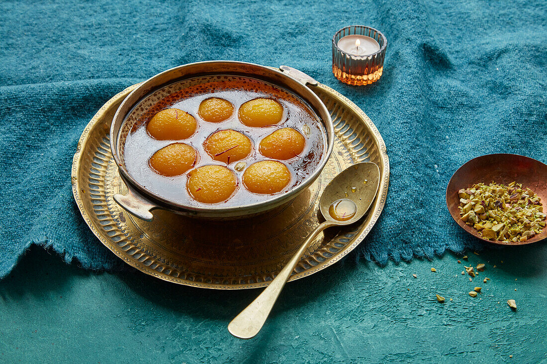 Gulab Jamun (fried dough balls, India) with cardamom in rose syrup