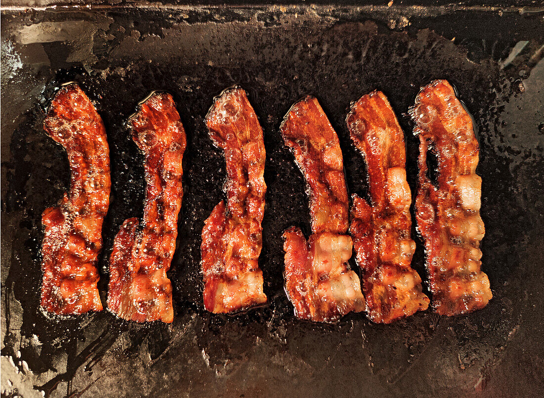 Frying strips of bacon