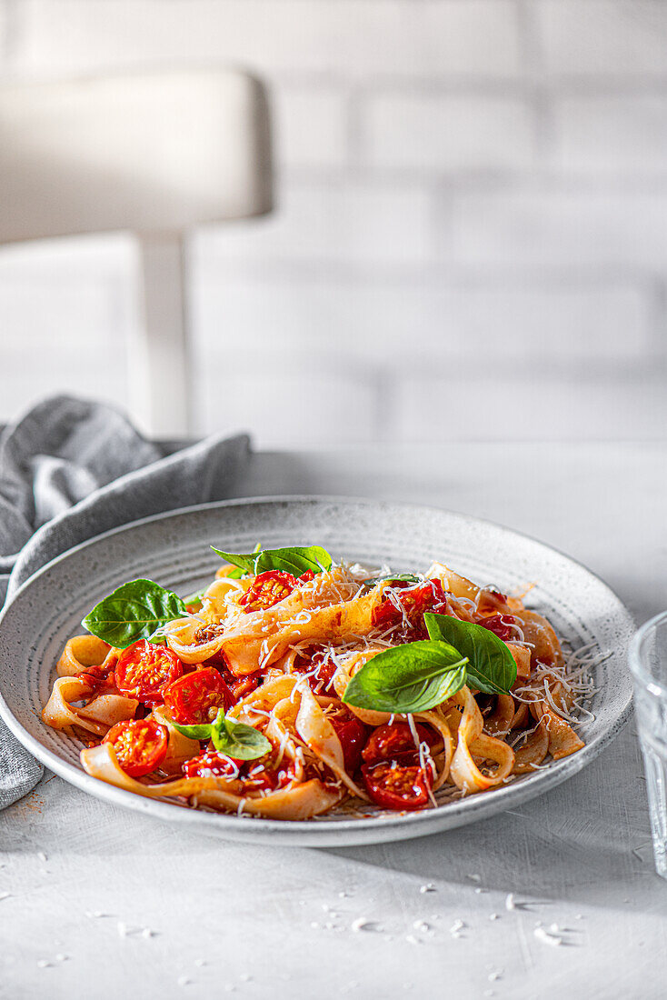 Tagliatelle with roasted cherry tomatoes and parmesan cheese