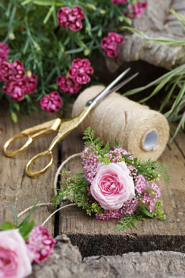 Mini bouquet of spiraea, rose and carnations