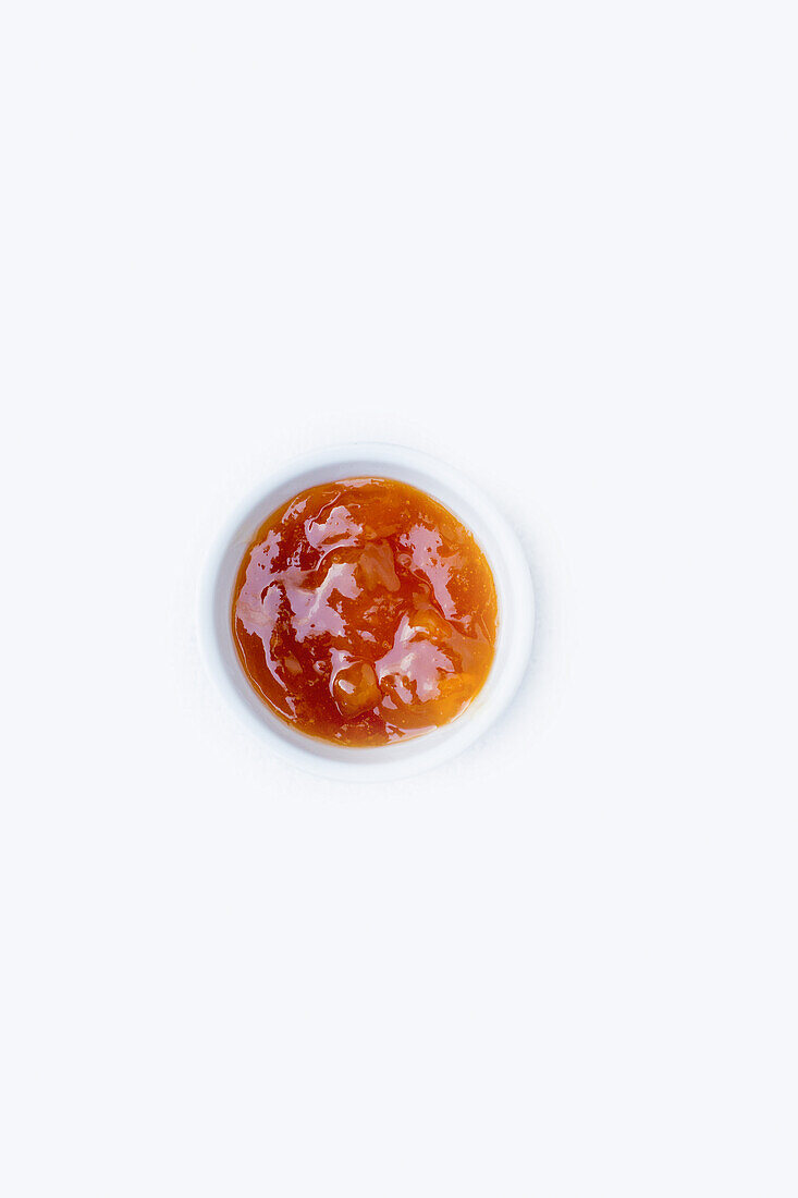 Apricot jam in a small bowl