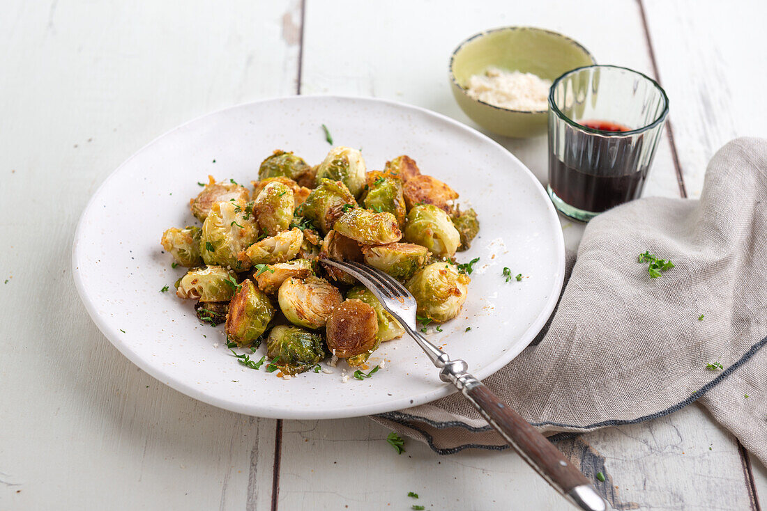 Oven roasted brussels sprouts with vegan parmesan substitute