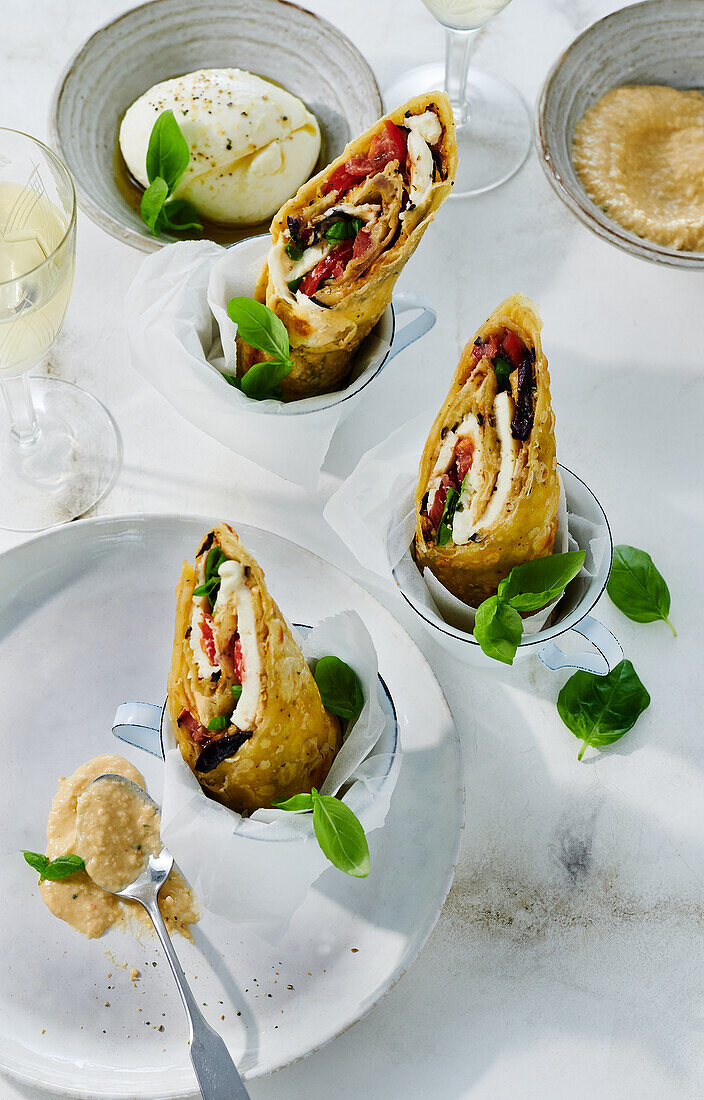 Mini wraps with burrata served in cups