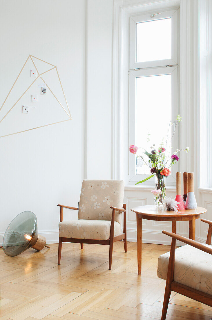 Vintage armchair and side table in the corner of a room