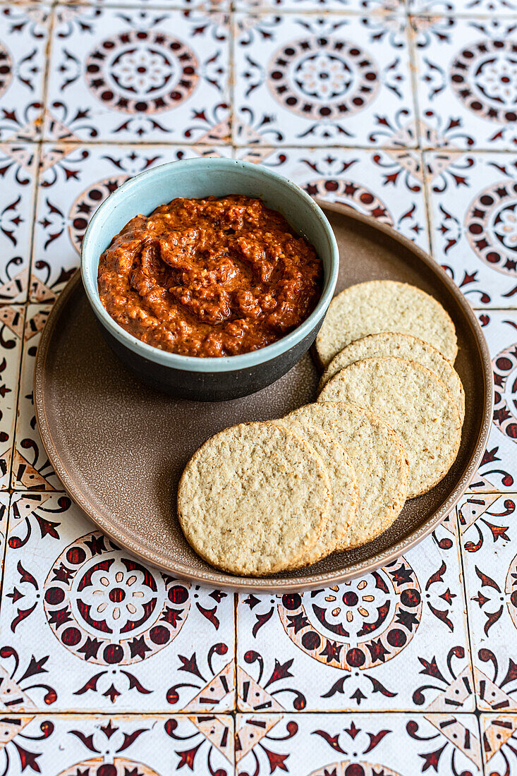 Muhammara - a spicy dip made of walnuts, red bell peppers, pomegranate molasses, and breadcrumbs. It originated in Aleppo, Syria.