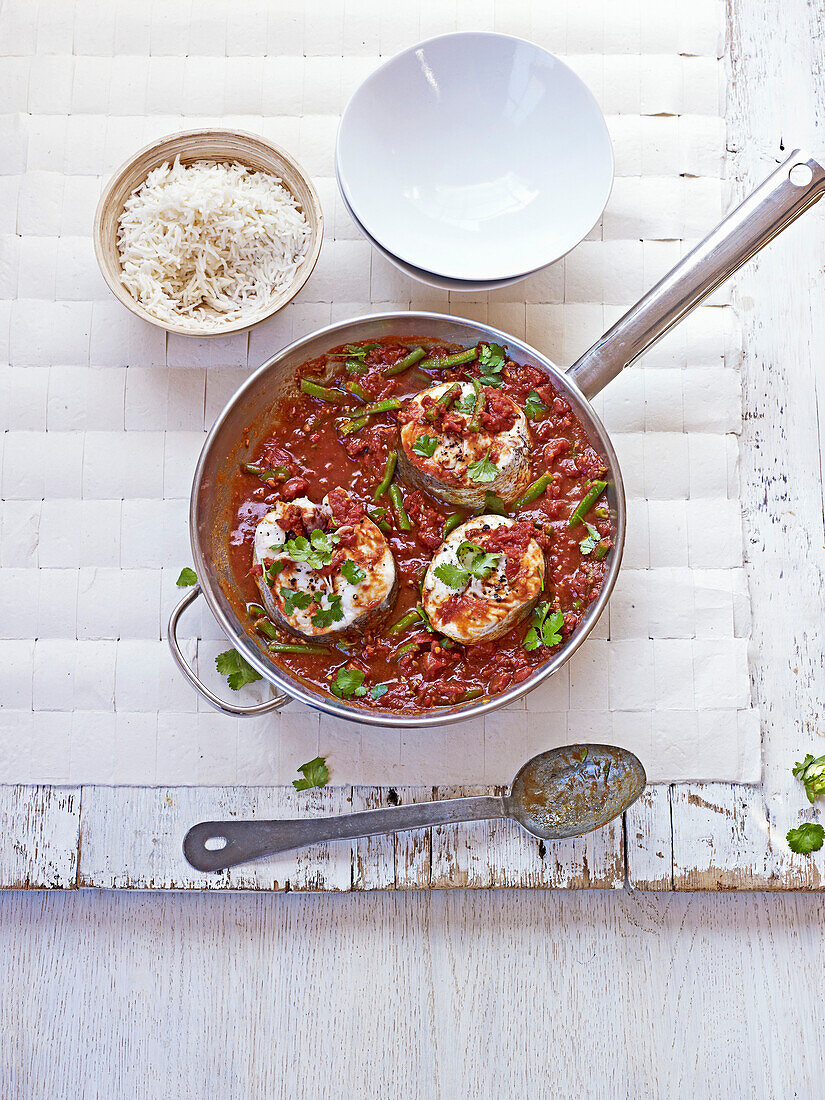 Tomato fish curry with tamarind served with rice