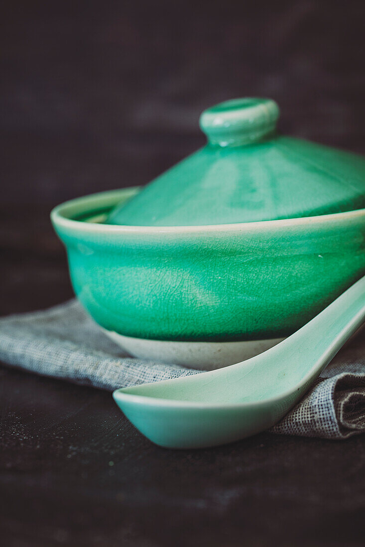 Asian soup bowl with lid and soup spoon