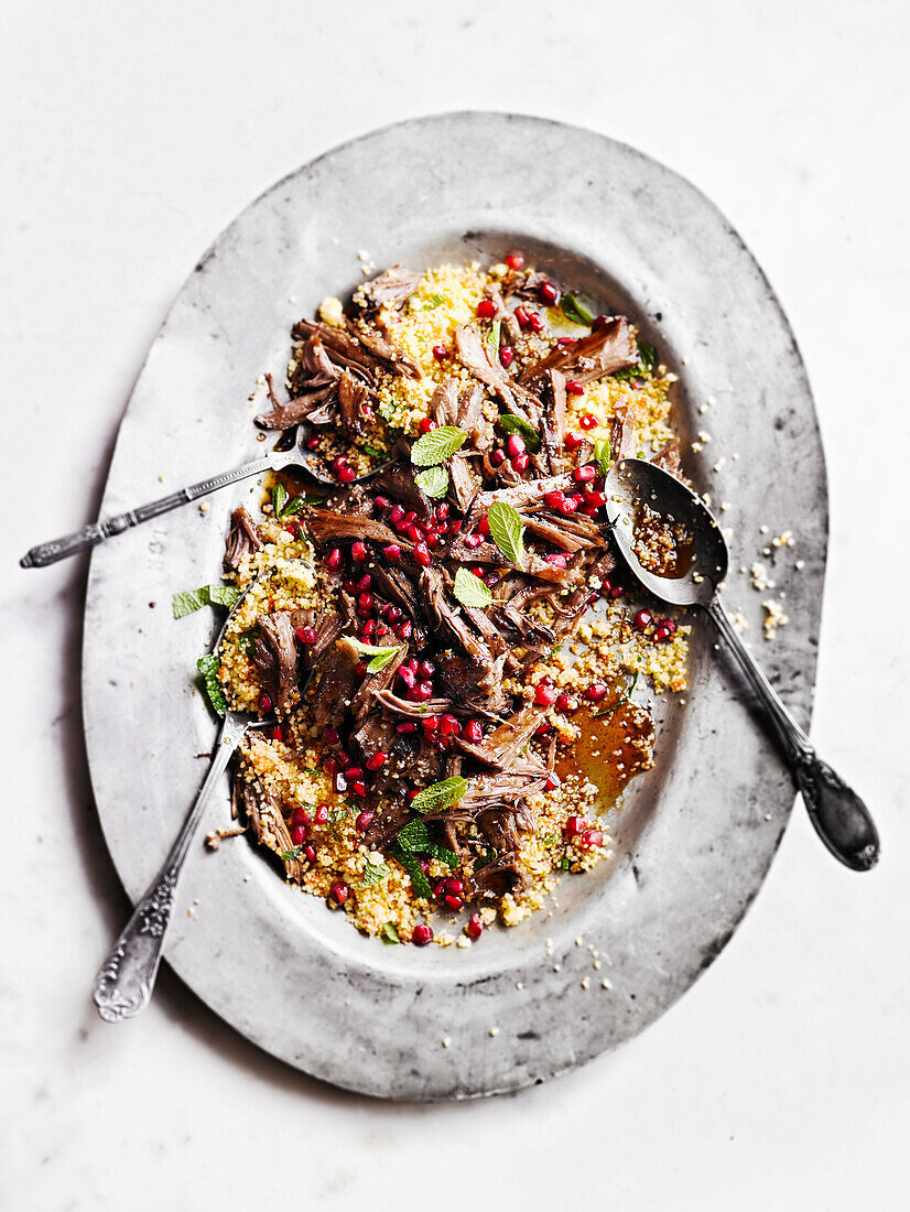 Slow-cooked lamb with couscous and pomegranate