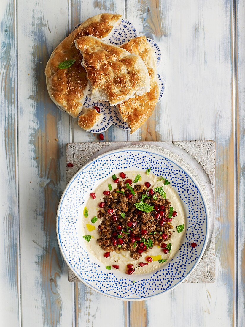 Whipped hummus with lamb and pomegranate seeds