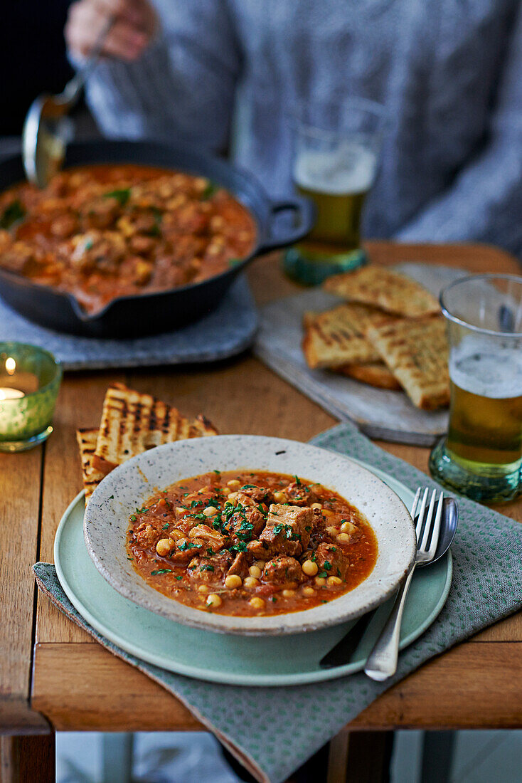 Chickpea casserole with chorizo and pork belly
