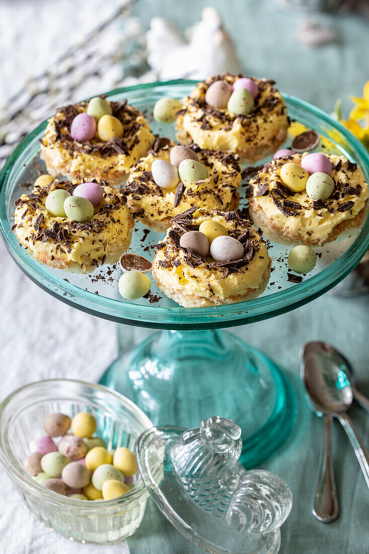 Easter almond cakes with butter cream and sugar eggs