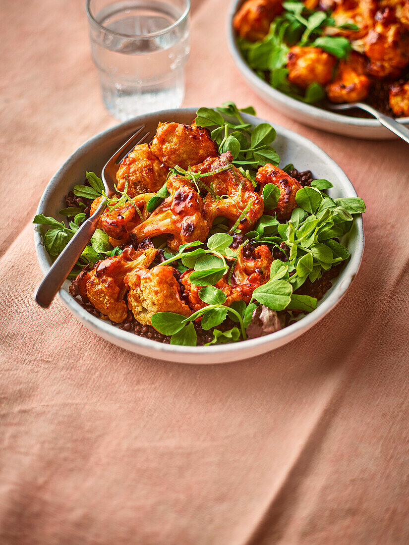 Cauliflower 'wings' on a lentil salad