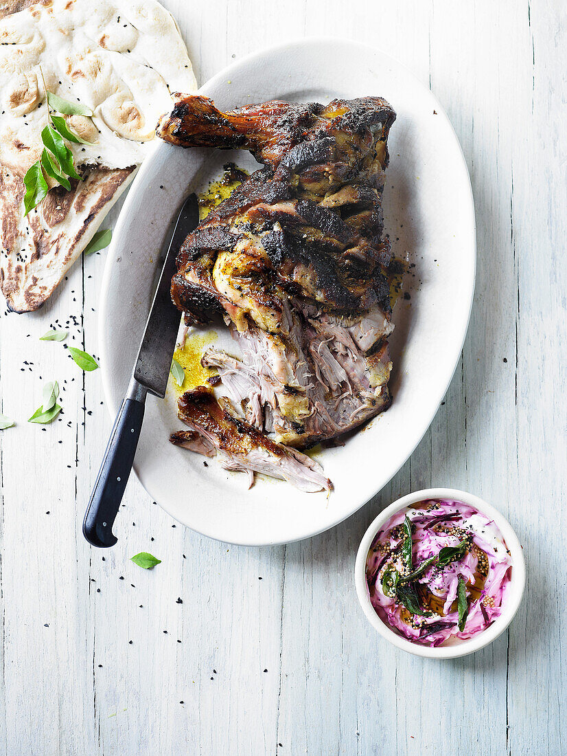 Barbecued spiced lamb shoulder with beetroot raita