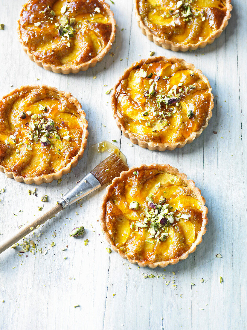 Nectarine and pistachio tartlets