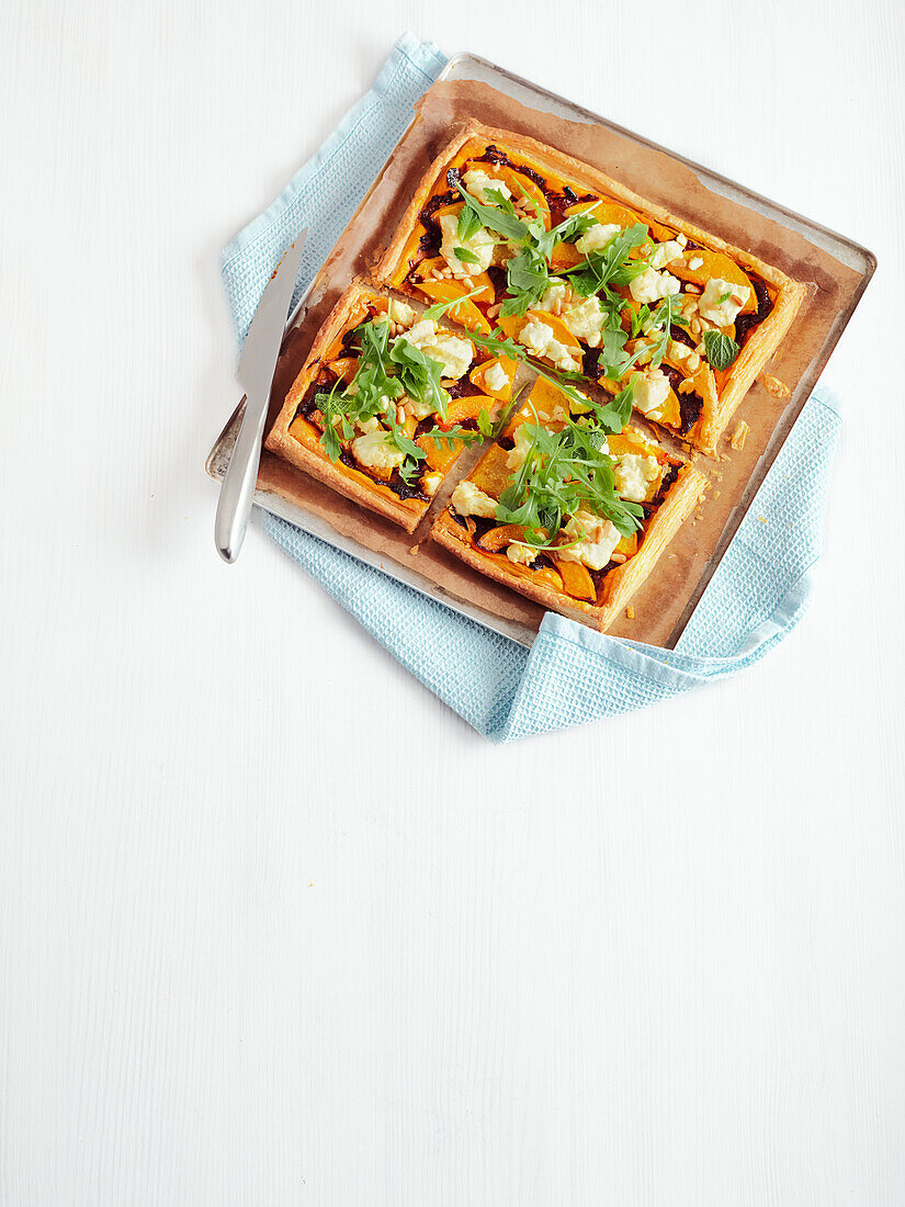 Pumpkin and feta tart with pine nuts