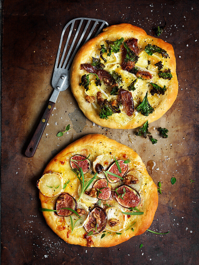 Kale and date pizza and fig and goat cheese pizza