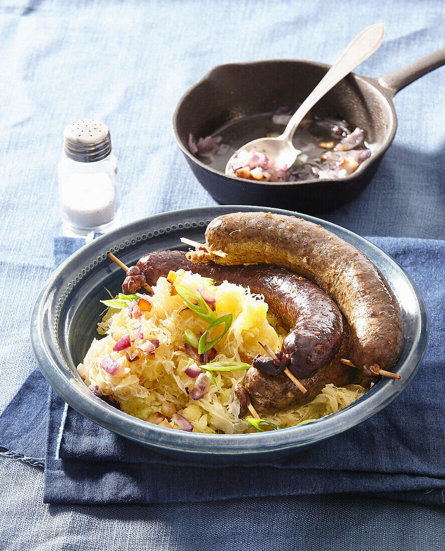 Blood sausage and white pudding with sauerkraut and potatoes