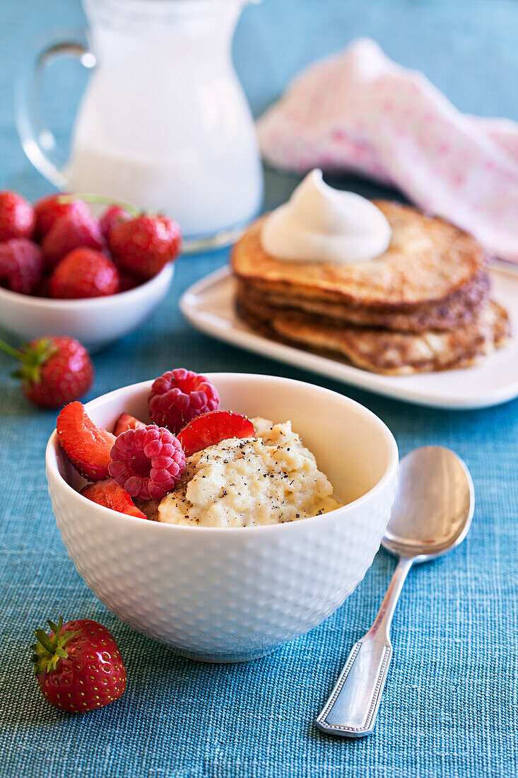 Healthy breakfast: Porridge with berries and pancakes