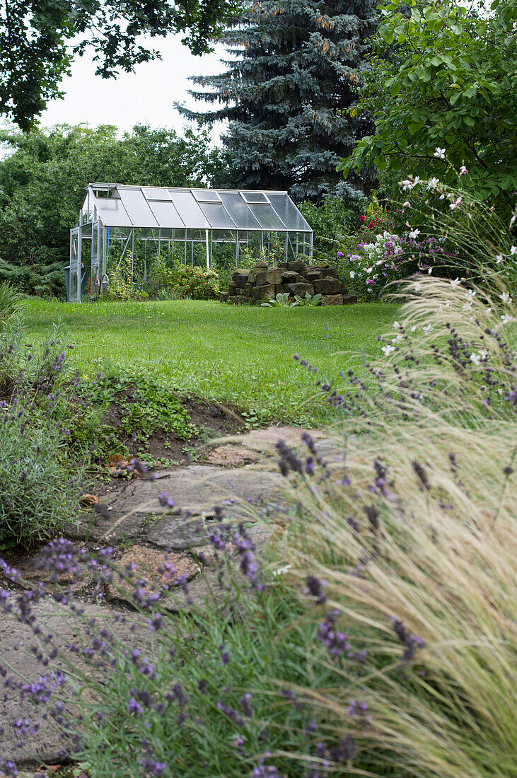 A greenhouse in a natural garden