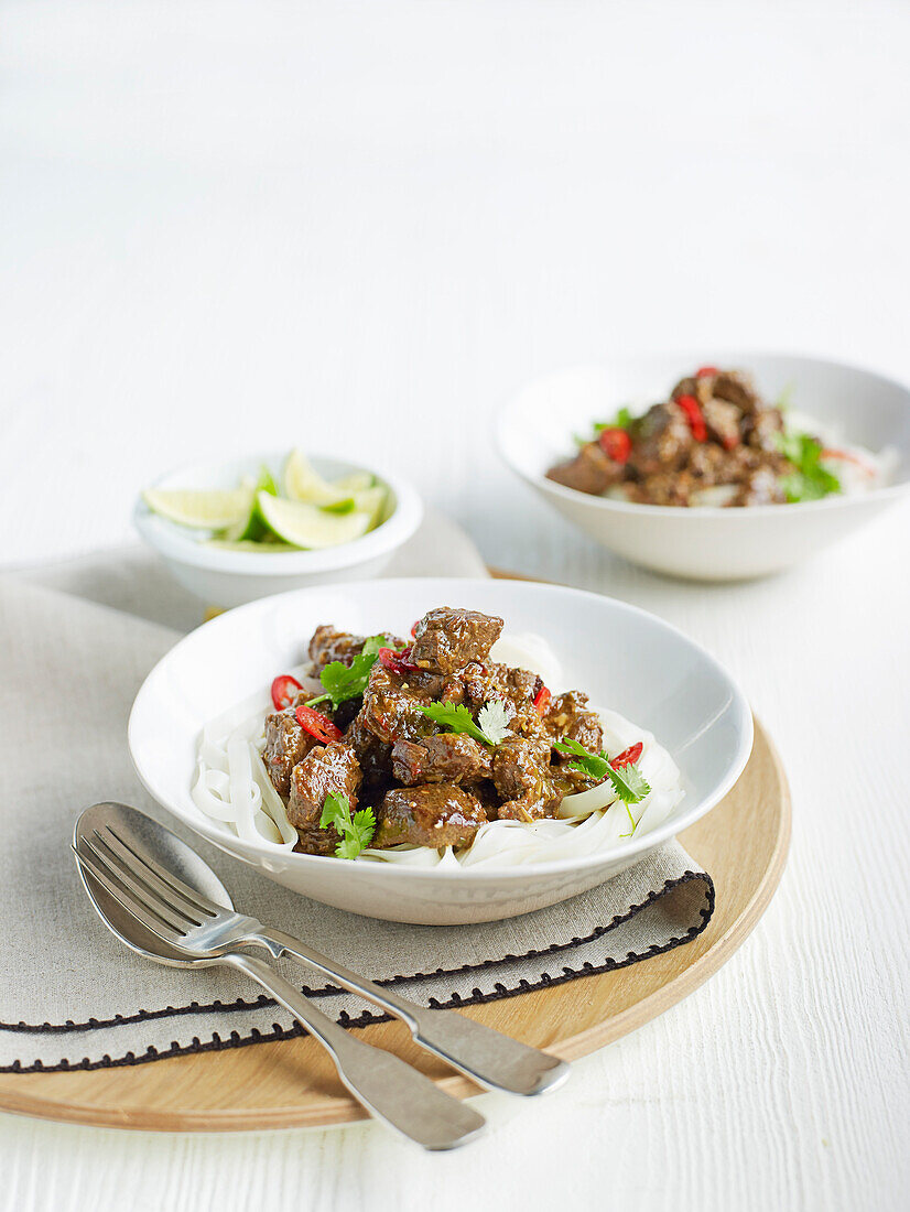 Beef stew with lemongrass on rice noodles