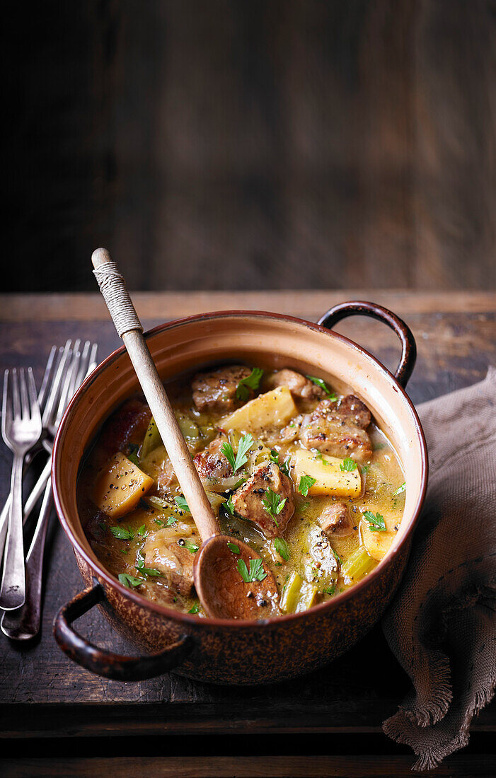 Slow-cooked pork shoulder with cider and parsnips