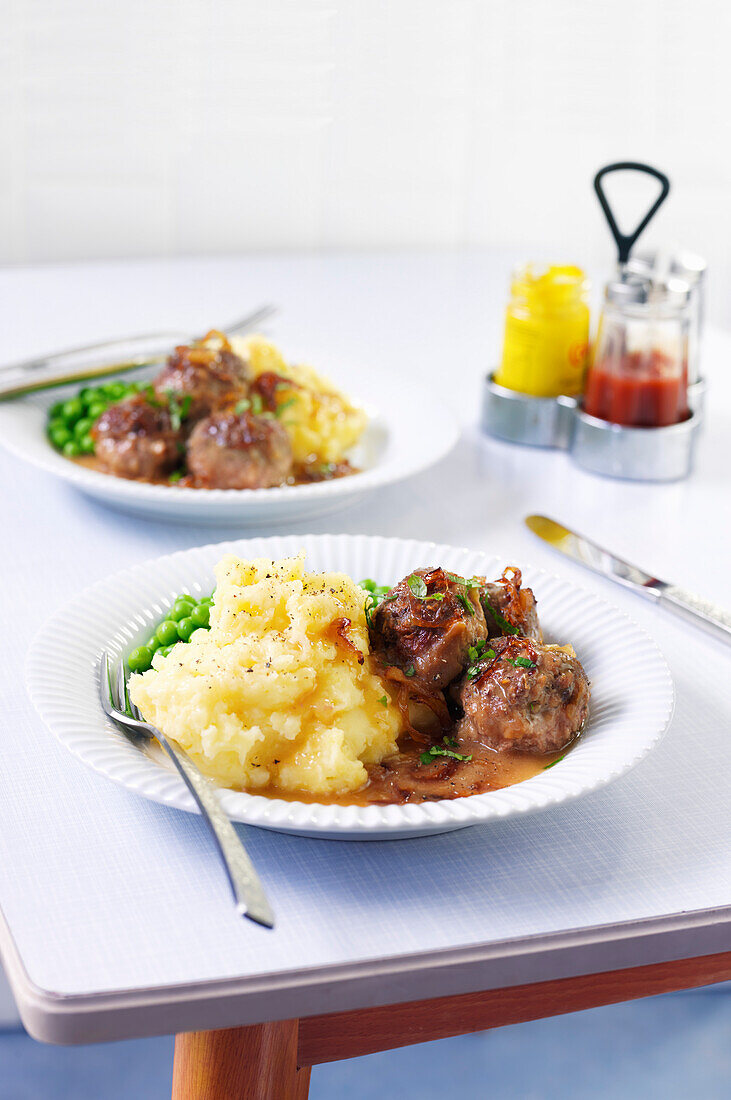 Meatballs with mashed potatoes and onion gravy