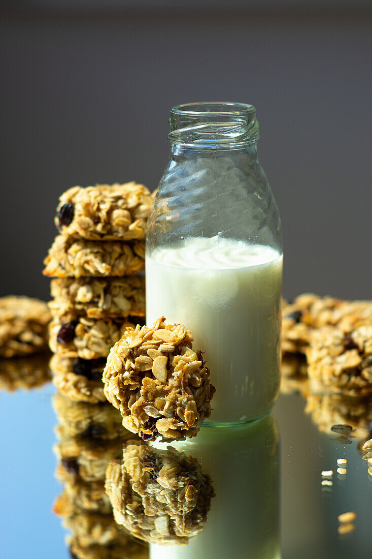 Oatmeal cookies and a glass bottle of milk